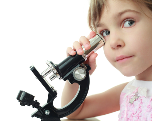 girl using a microscope